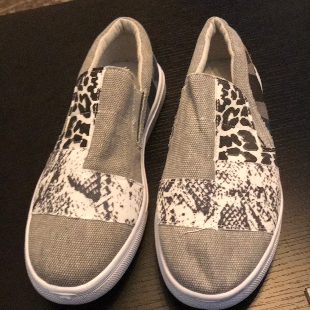 Canvas slip on shoes in a multiple animal print.